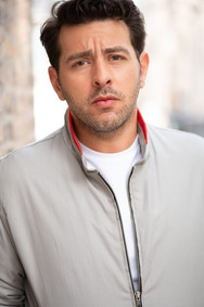 actor headshot young man brooding outdoor city
