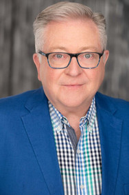 actor headshot older man silver hair blue blazer