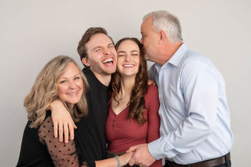 Laughing family portrait in studio best fun