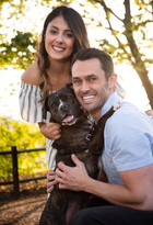 Outdoor chicago couple portrait with smiling dog