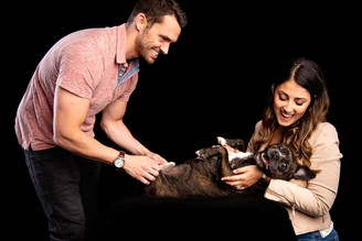 Couple tickling dog studio chicago portrait