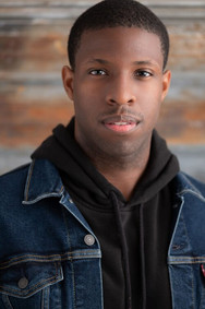 actor headshot young black man jean jacket
