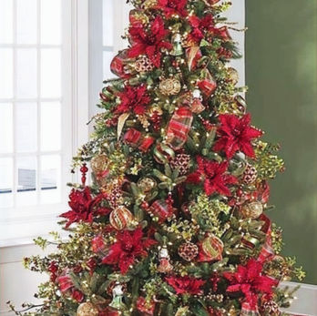 a traditional Christmas tree dressed in reds & golds