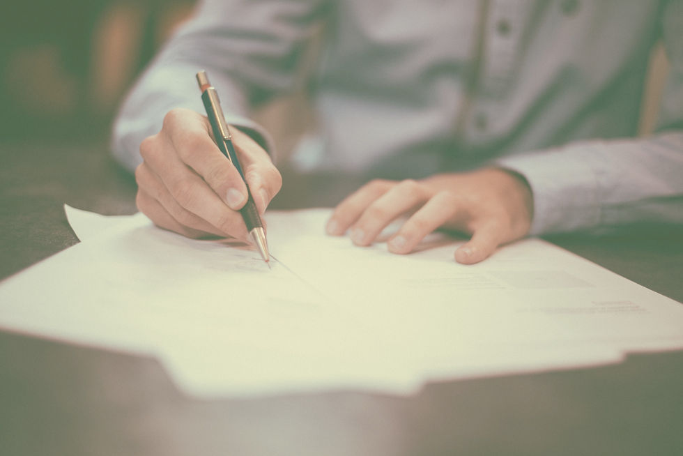 A man signing a mortgage contract in Germany