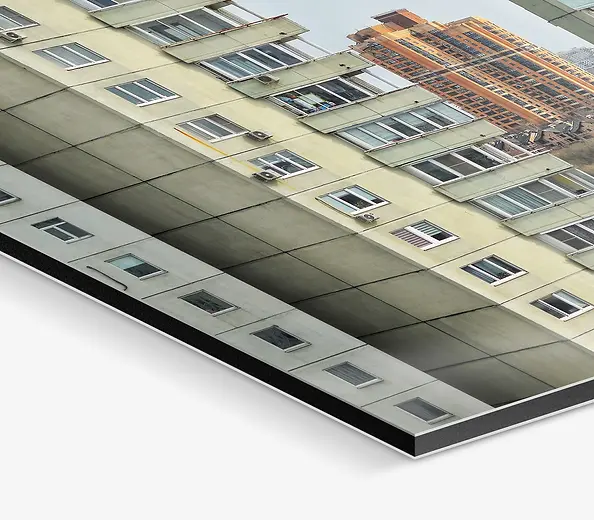 A photograph of an example of an unframed aluminium print featuring a close up of the corner.