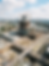 Firefly_Gemini Flash_Construction site aerial view, modern building under development, cra