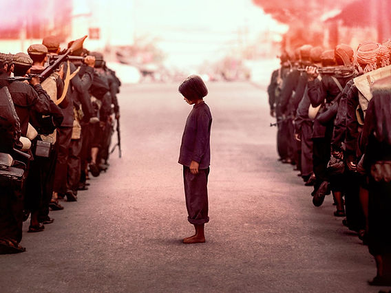 First They Killed My Father: A Tale of Surviving Against Impossible Odds 1 Loung Ung stands alone between rows of Khmer Rouge soldiers in First They Killed My Father