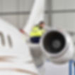Airport workers check an aircraft for safety in a hangar .jpg