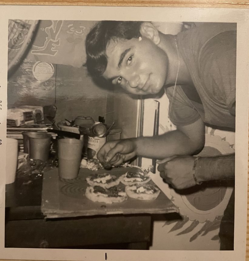 Four rounds of dough assembled on a cardboard tray, December 1969