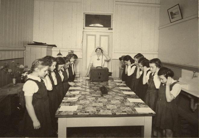 Schoolchildren taking a hearing test