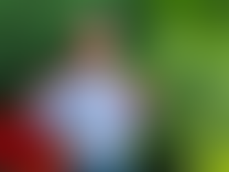 a picture of a child with a red cape and red mask standing with hands on hips