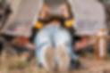 woman-looking-her-tablet-her-tent-while-camping.jpg