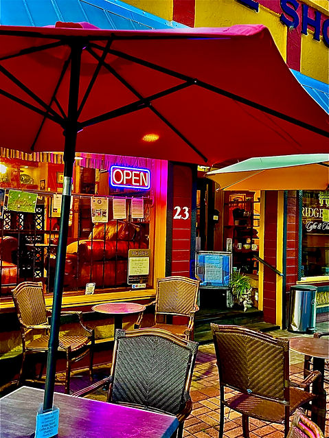 Neon open sign over the patio atr dusk