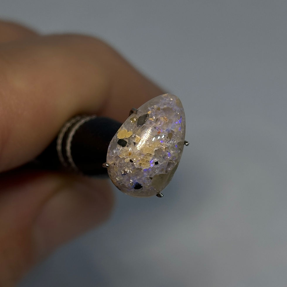 Thumbnail: Polished Pinpoint Louisiana Hidden Fire Opal Stone