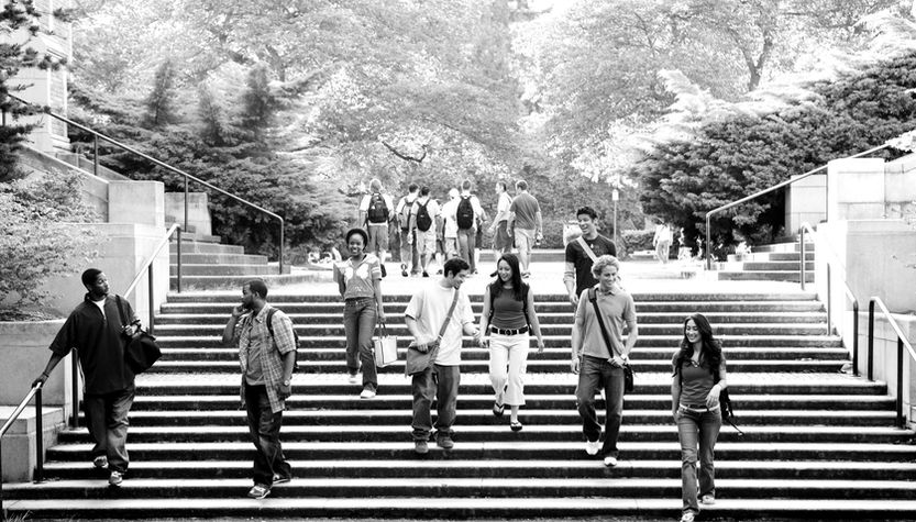 Stock photo of students walking down steps on college campus