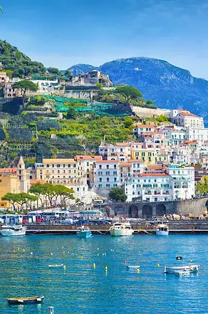 panoramic-view-of-beautiful-amalfi-on-hills-leading-down-to-coast.webp