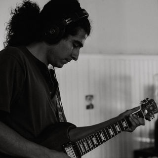 Guitarist in recording studio