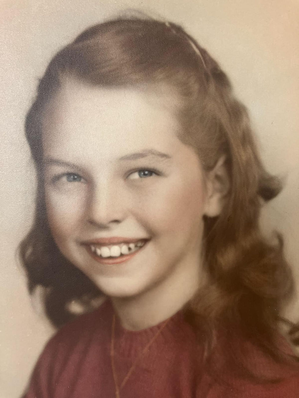 portrait of a young girl in a red sweater