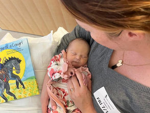 Woman holding a very ill newborn