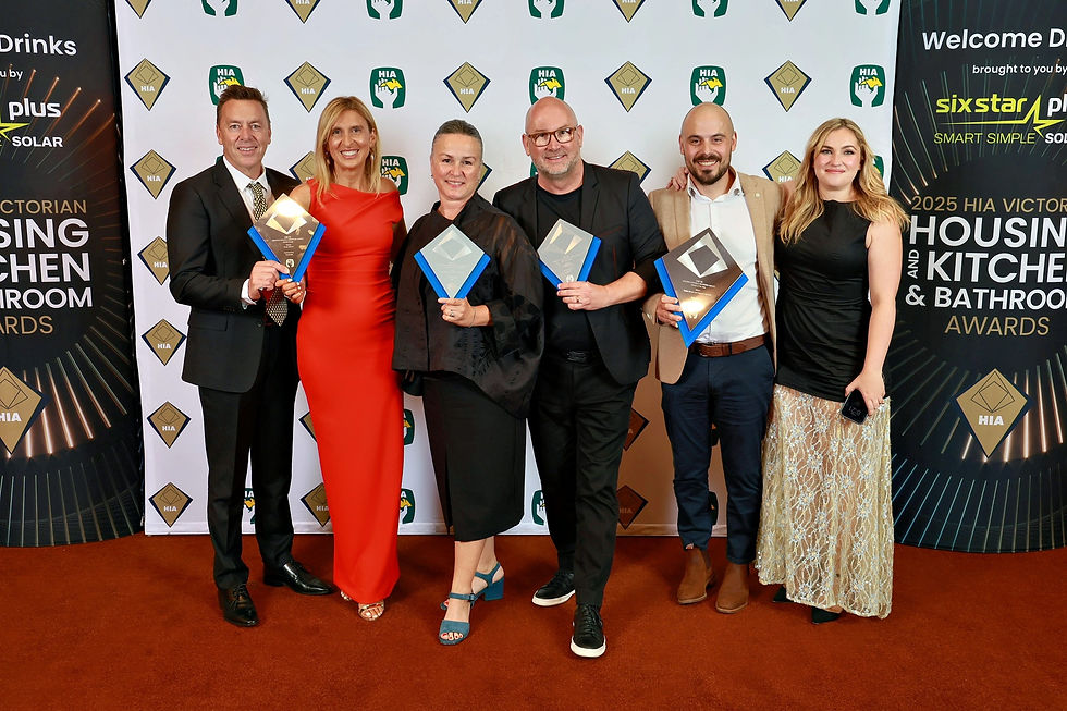 Darren and Simona accepting an award at the 2025 HIA Kitchen and Bathroom Awards where they won Kitchen of the Year, Kitchen Design of the Year, Kitchen Renovation over $100K and Bathroom Design of the Year.