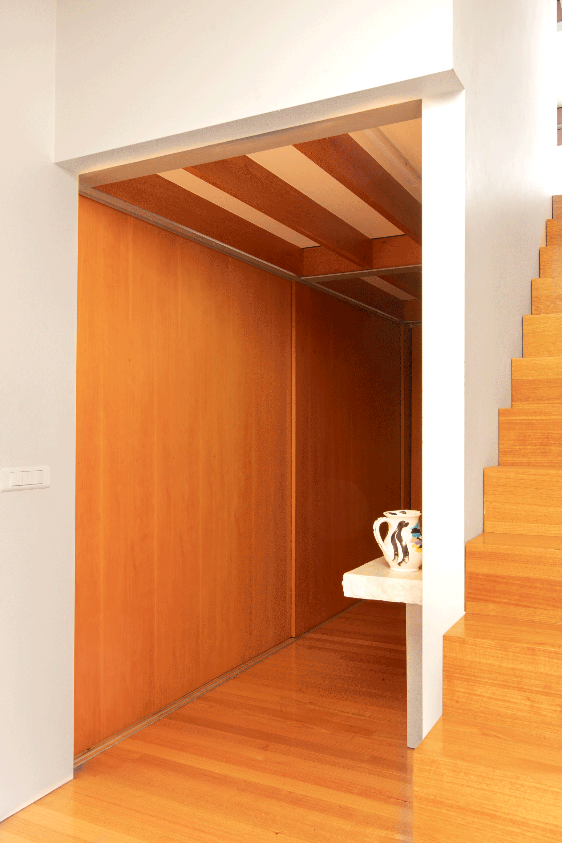 Timber bedroom with sliding door entrance