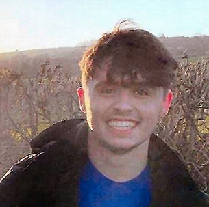 Dylan Price smiling outdoors in Shropshire