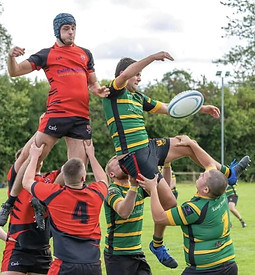 Dylan Price Memorial rugby game with players jumping for the ball