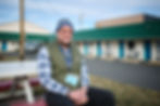 CJ Dezort sits outside the Franklin Avenue Shelter in Bend. Dezort is a program director with Shpeherd’s House Ministries. Photo by Joe Kline.