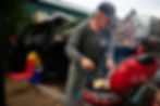 Todd Walters grills chicken outside The Lighthouse in Bend. Walters said he regularly grills on the sidewalk outside The Lighthouse and shares with anyone passing by. Photo by Joe Kline