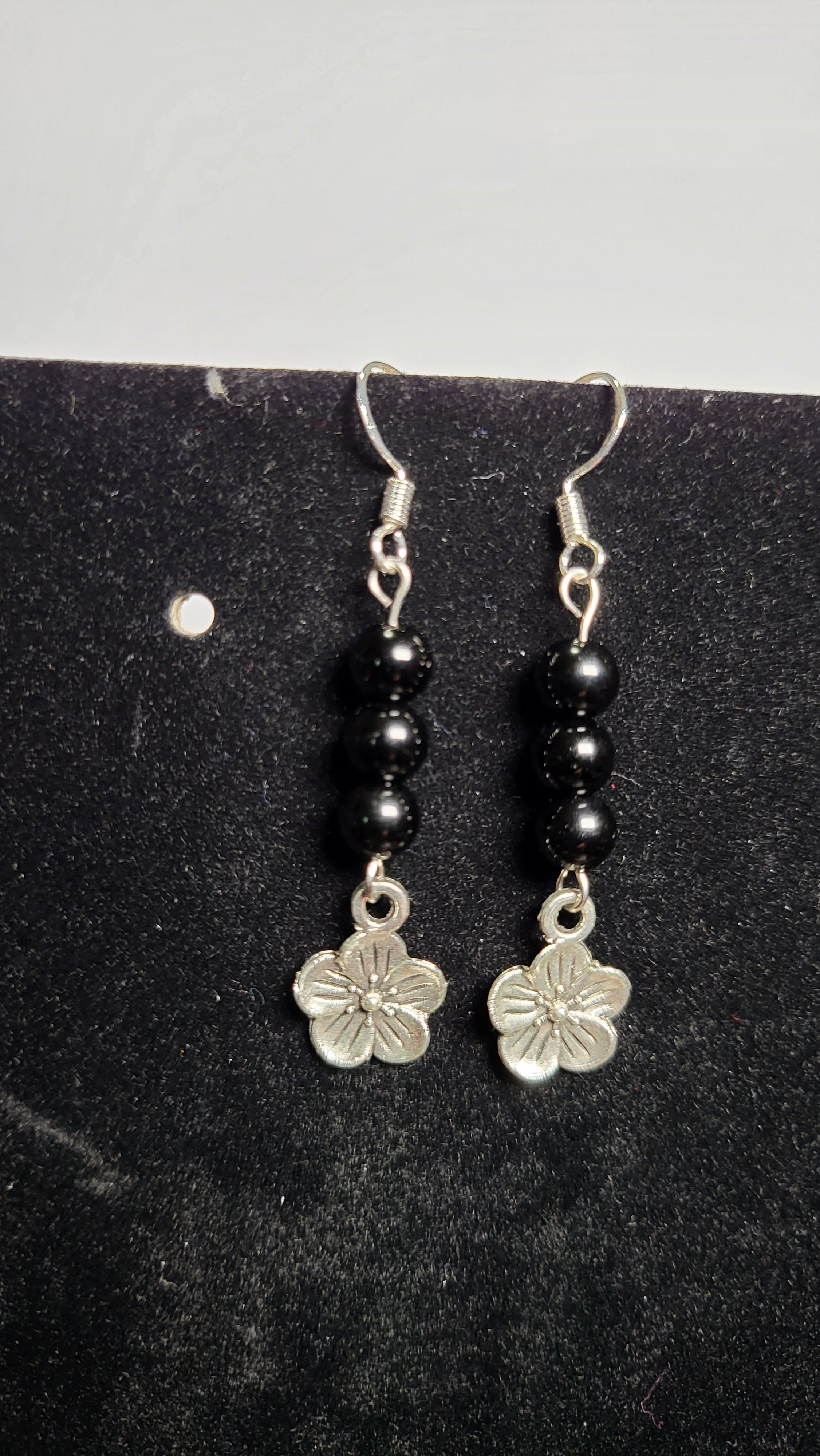 Obsidian earrings with flower charms