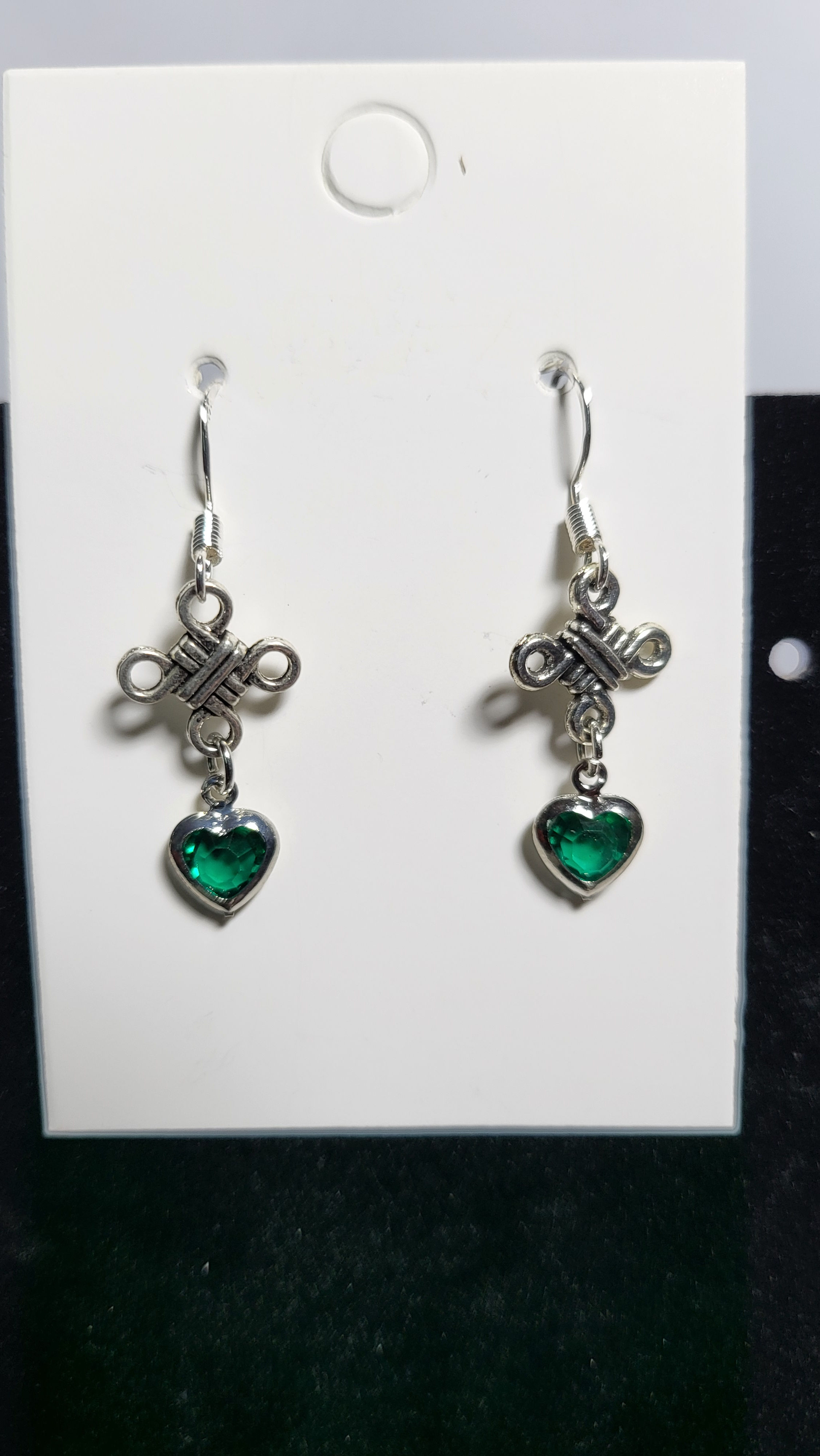 Celtic cross with green glass hearts