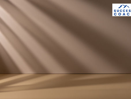 a beige wall with light and shadow