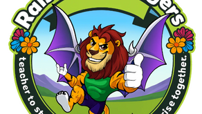 Circular “Raised By Rangers” logo featuring a cheerful lion character with maroon mane, golden fur, and purple bat-like wings giving two thumbs up. The lion wears a green shirt and purple shorts, standing against a scenic mountain and meadow background. The outer ring is dark green with the slogan “teacher to student, from spark to flame — we rise together” written around it, accented by bright orange and pink flowers on each side.