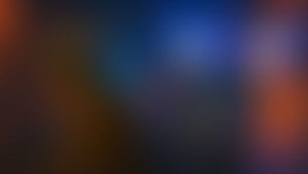 A luminous scene featuring three fantasy animals against a glowing city backdrop. On the left sits a small spotted lynx-like creature with bright blue eyes, translucent blue wings, and a glowing line of crystalline spines along its back. In the center stands an ordinary gray pigeon, plain and unlit. Behind it rises the same pigeon in its transformed state—a radiant blue-and-orange winged form glowing with neon light. The contrasting figures depict a shift from ordinary to luminous, set amid warm orange and cool blue city lights.