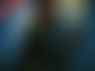 A powerful armored woman with deep bronze skin and braided red hair kneels on a rooftop at night, her expression focused and alert. Crystal-like wings made of glowing multicolored shards extend from her back, casting iridescent light. Perched calmly on her gloved hand is a radiant pigeon with a soft halo of warm light around its head, feathers shimmering in pastel hues. A dark city skyline rises in the background beneath a star-speckled sky. A red diagonal banner in the top left corner reads “COMMUNITY SUBMISSION.”