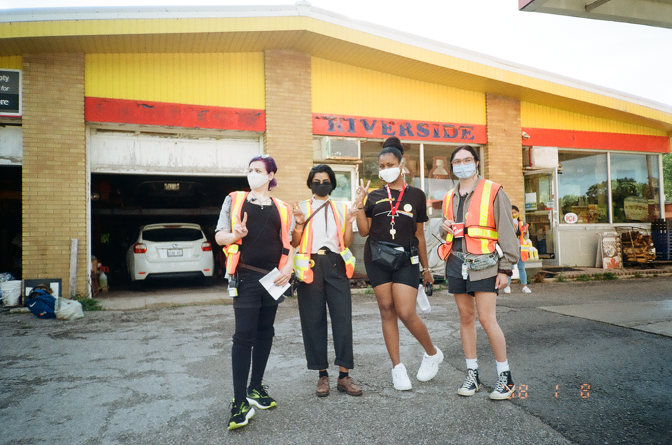 Four crew members pose on the film set of "Something You Said Last Night".