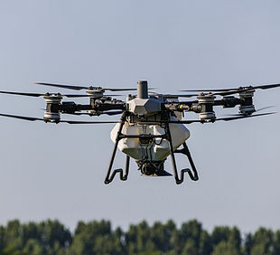 DJI Agras T100 épandeur pour pilotes agricoles en Suisse_modifié.jpg