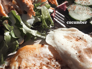 Chicken and Kale Salad served with Eggs and Cucumber Slices