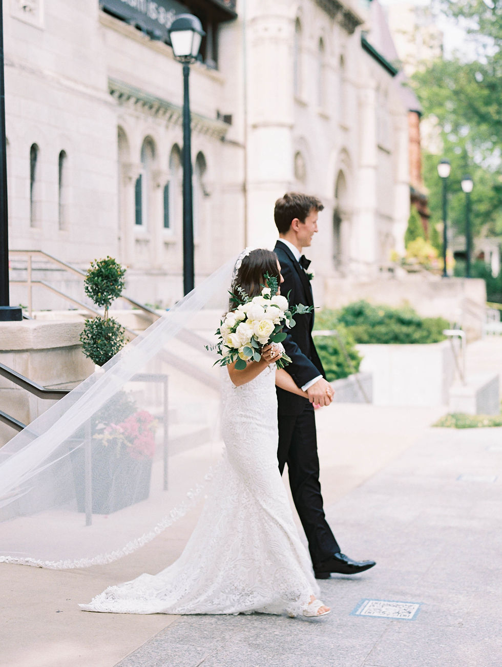 Bride and groom holding hands