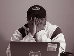 A man frustrated with his computer.