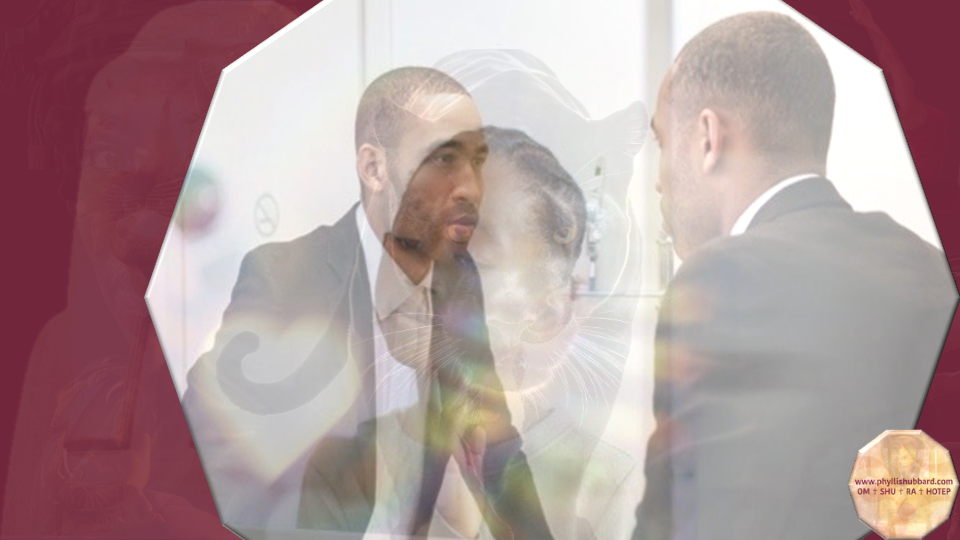 Black male looking at his child self in the mirror