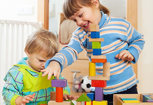 siblings-together-playing-with-toys.jpg