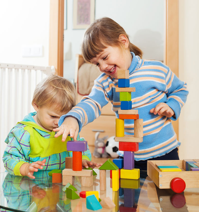 siblings-together-playing-with-toys.jpg