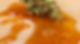 Cannabis wax on a parchment paper and THC concentrate