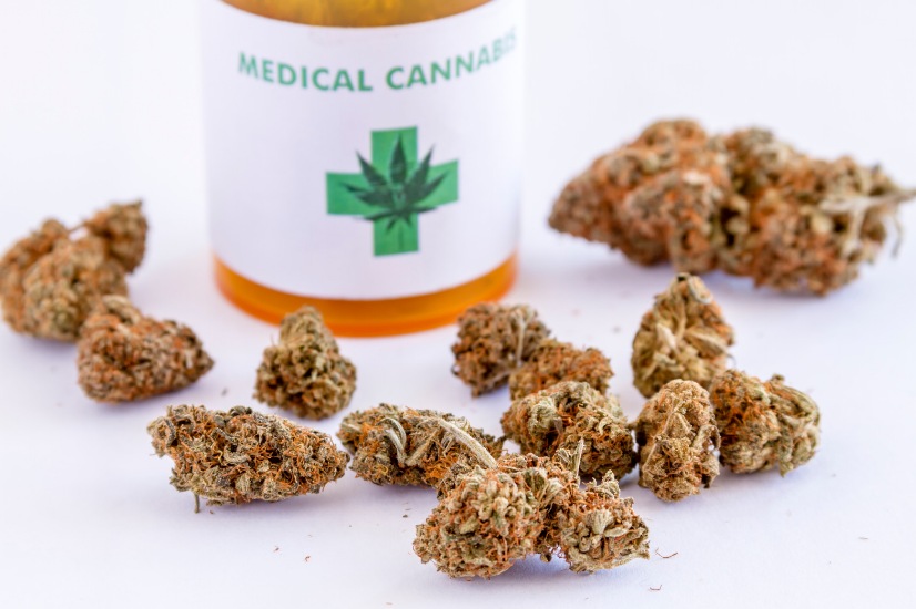 A medical marijuana patient holding his identification card.