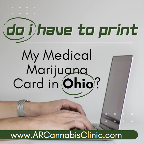 a man on a open laptop: Do I Have to Print My Medical Marijuana Card in Ohio?