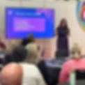 JP Training founder Jessica stands in front of a screen and delivers theManagement Development Programme for a group of people