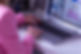 Jo from Ladybird SEO on Laptop. You can just see her arms and she is wearing a pink jacket with matching pink nail polish.
