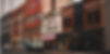 A rown of retail units in varying styles, each one an older building
