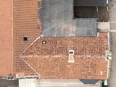 Drone image from above a heritage home - the roof has red tiles